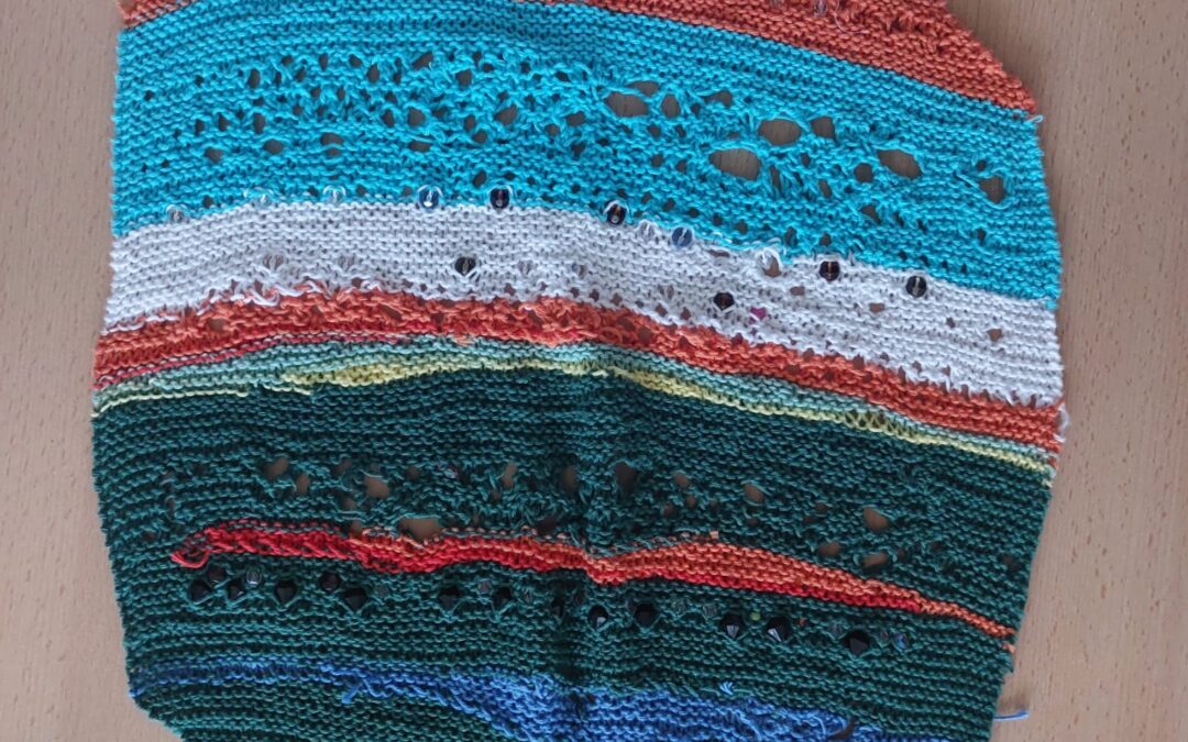 Im Gottesdienst gestricktes Perlenbild